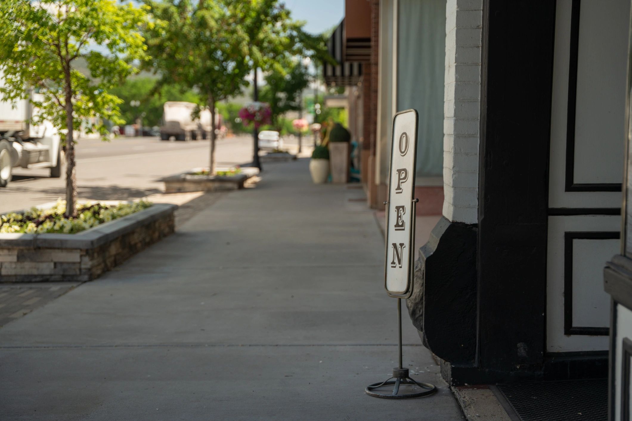 Business entrance with open sign and storefront display