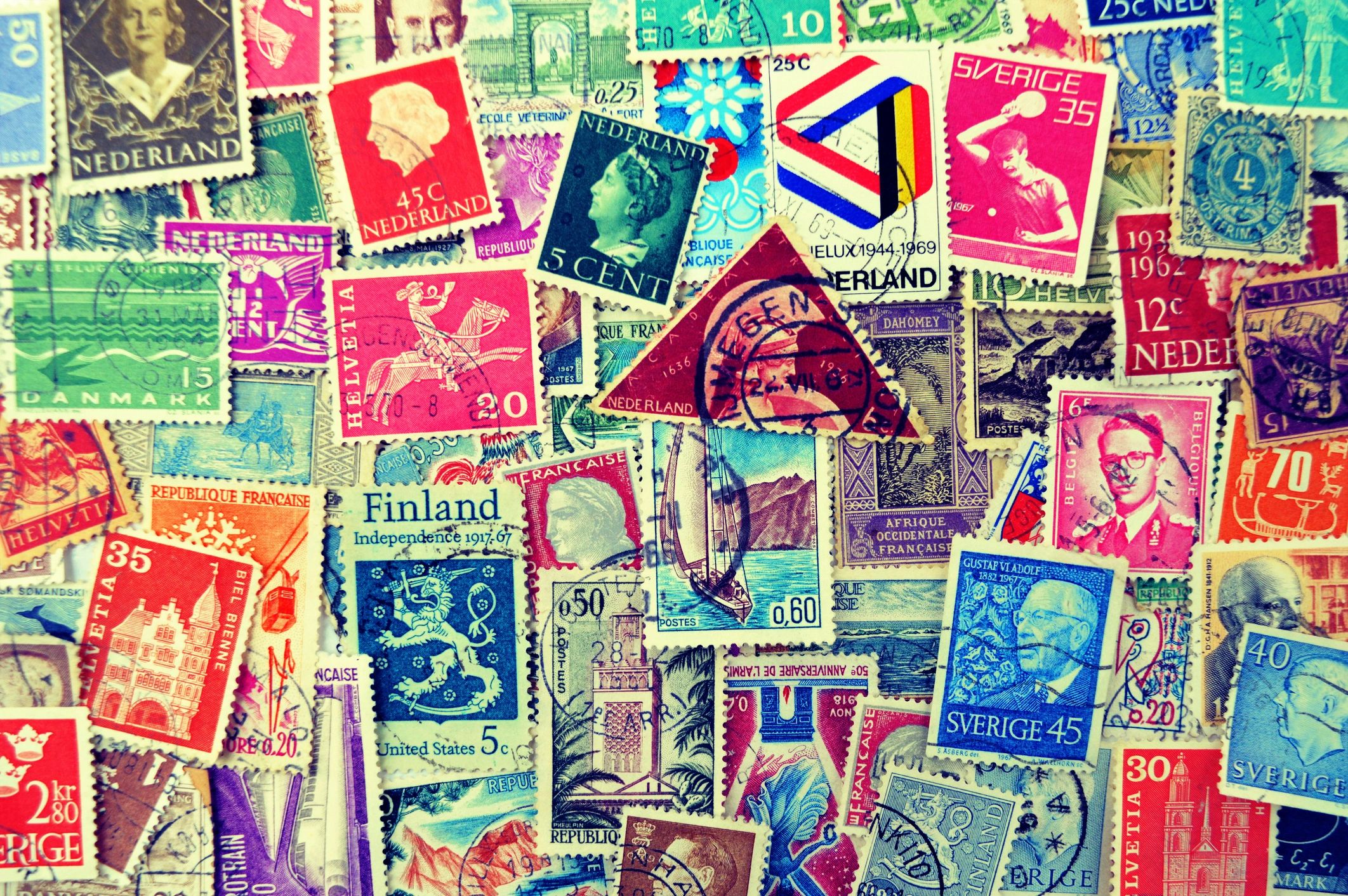 Background of vintage postage stamps for postcard mailing